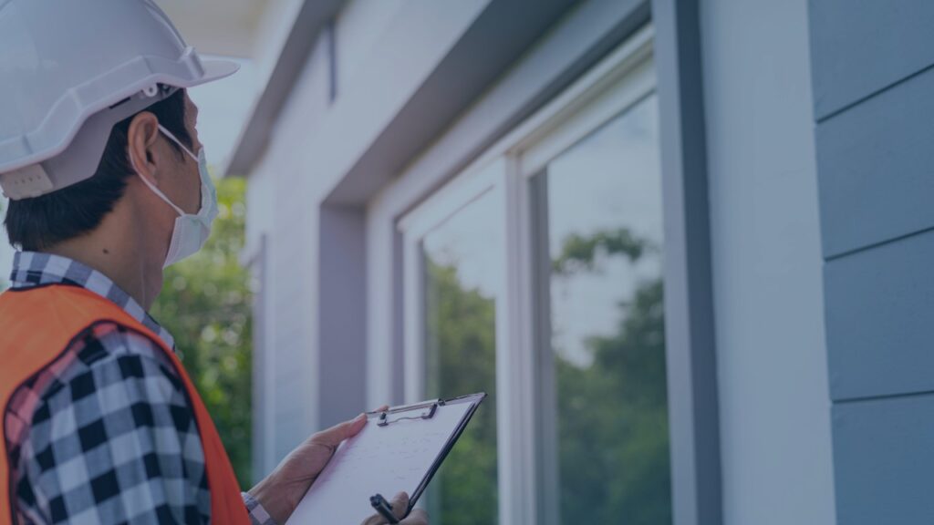 Home inspector evaluating a residential property during a home inspection before a real estate purchase.